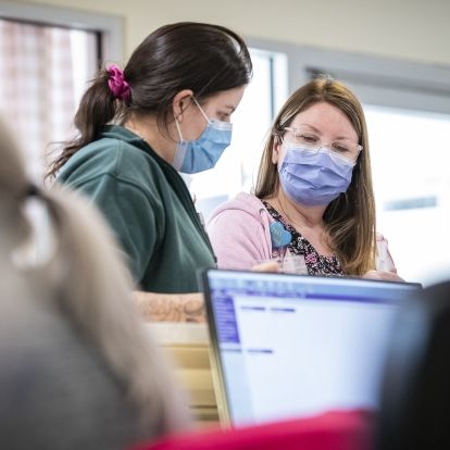 Nursing staff discuss patient care options in KHSC's Pediatric Critical Care Unit