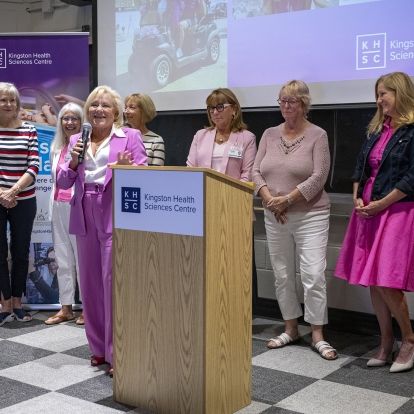 Members of the Rose of Hope committee gather for the announcement