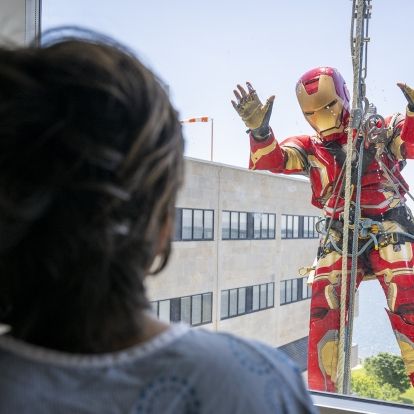 iron man waves at a patient at KHSC