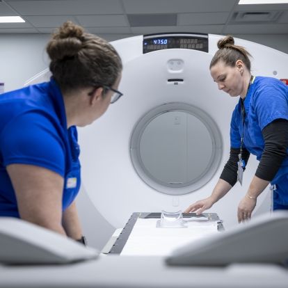 Staff work with KHSC's new PET-CT scanner