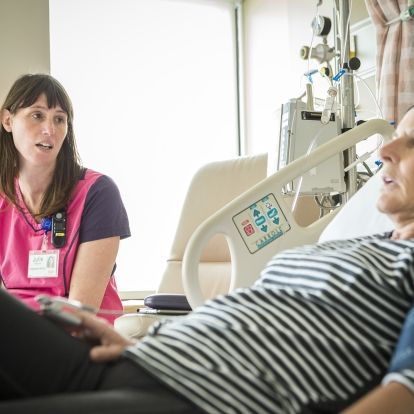 A KHSC nurse speaking with a patient