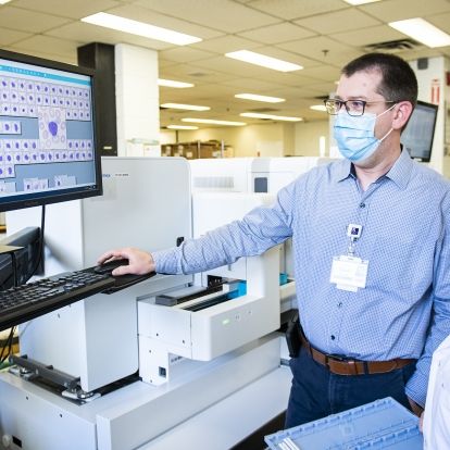 Dr. David Good reviews images using KHSC's new Complete Blood Count (CBC) analyzer with an integrated digital morphology system