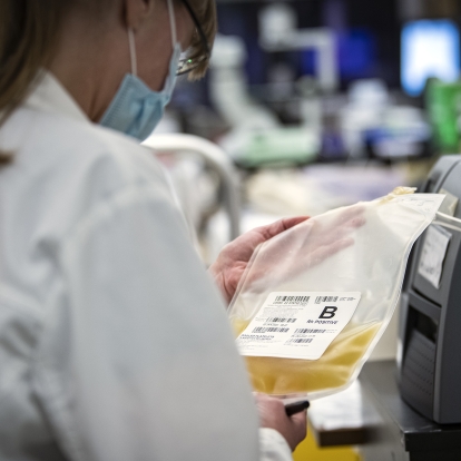 Lab techs unload a shipment of the new platelet product