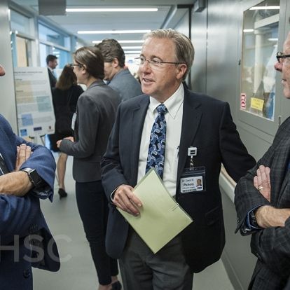 KHSC CEO Dr. David Pichora speaks with individuals touring the new centre