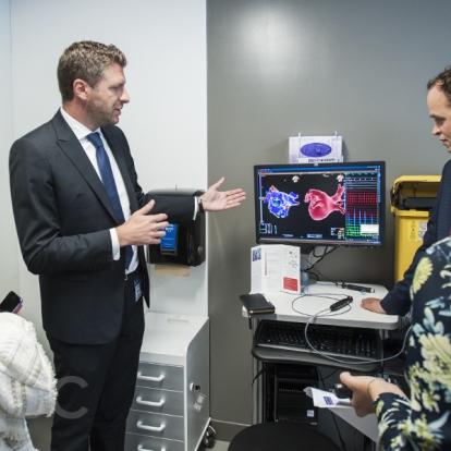 Dr. Gianluigi Bisleri and Dr. Ben Glover show their research to visitors during the grand opening