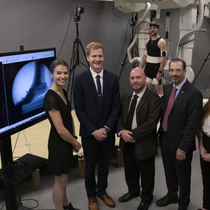 Researcher Dr. Michael Rainbow (centre) and Kevin Deluzio, dean of engineering and applied science, with graduate students (L-R) Lauren Welte, Mitchell Wheatley, Liam Rodgers and Zoe Mack.