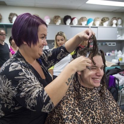 Josh holds the braid that was cut off by Andrew