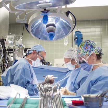 A multidisciplinary surgical care team working in the operating room at KGH.