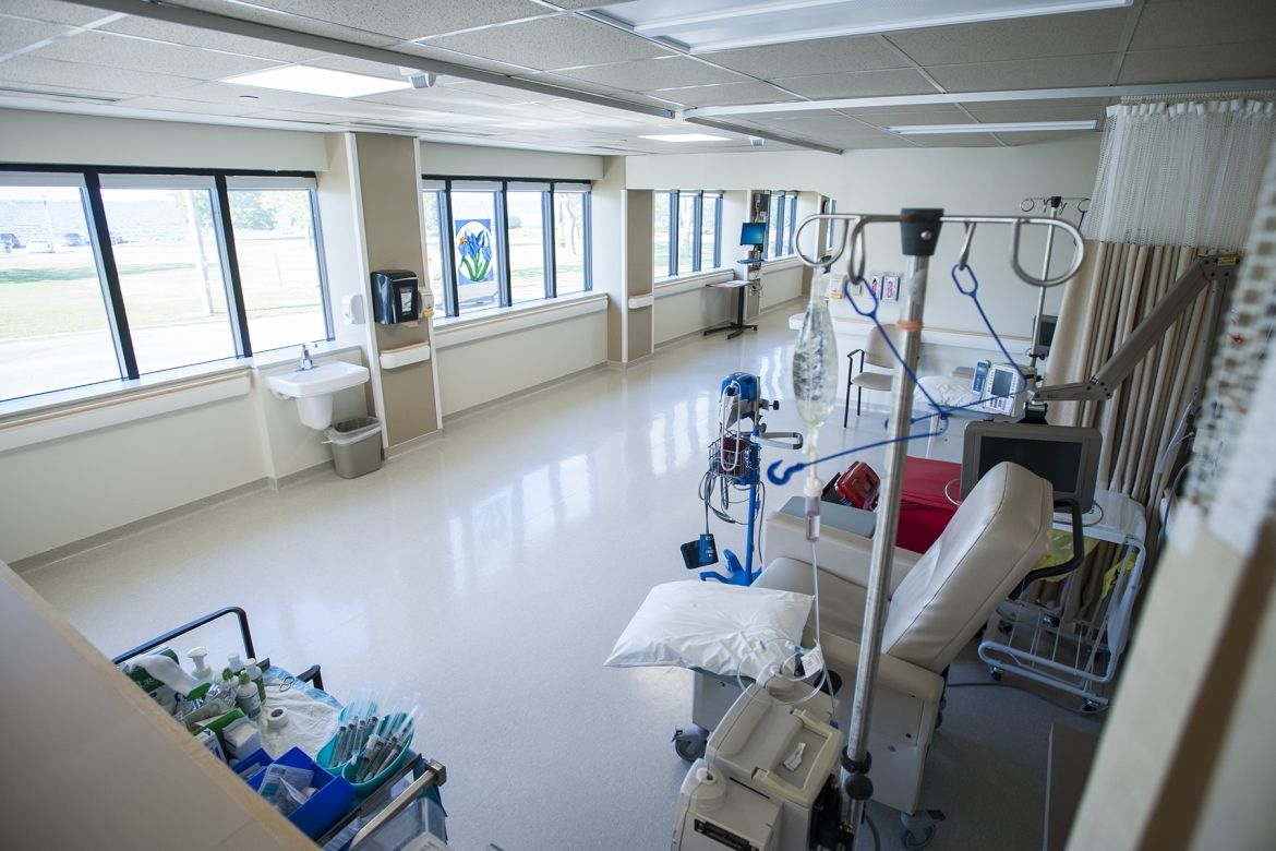 A row of chemotherapy chairs face windows looking out to Lake Ontario in KHSC.