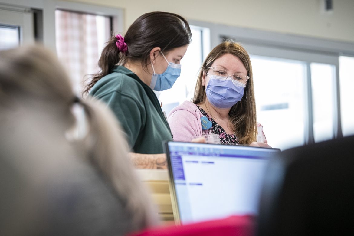 Nursing staff discuss patient care options in KHSC's Pediatric Critical Care Unit