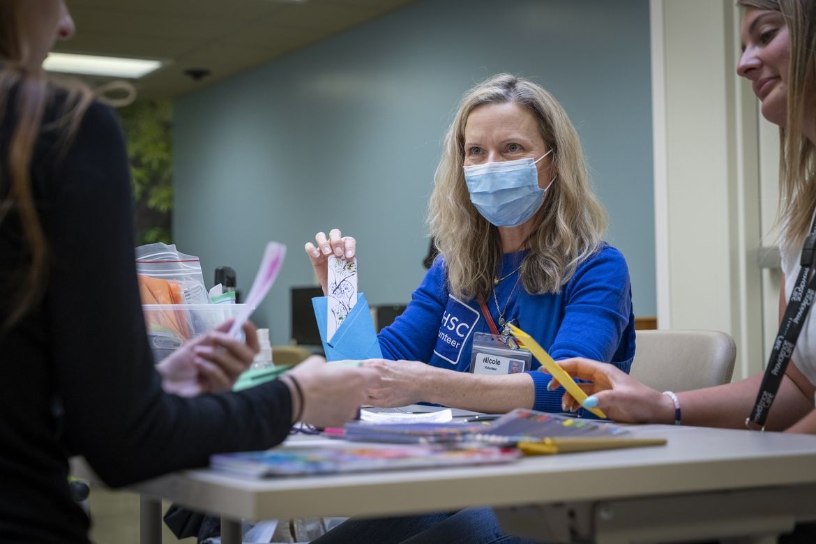 Volunteer working on crafting items.