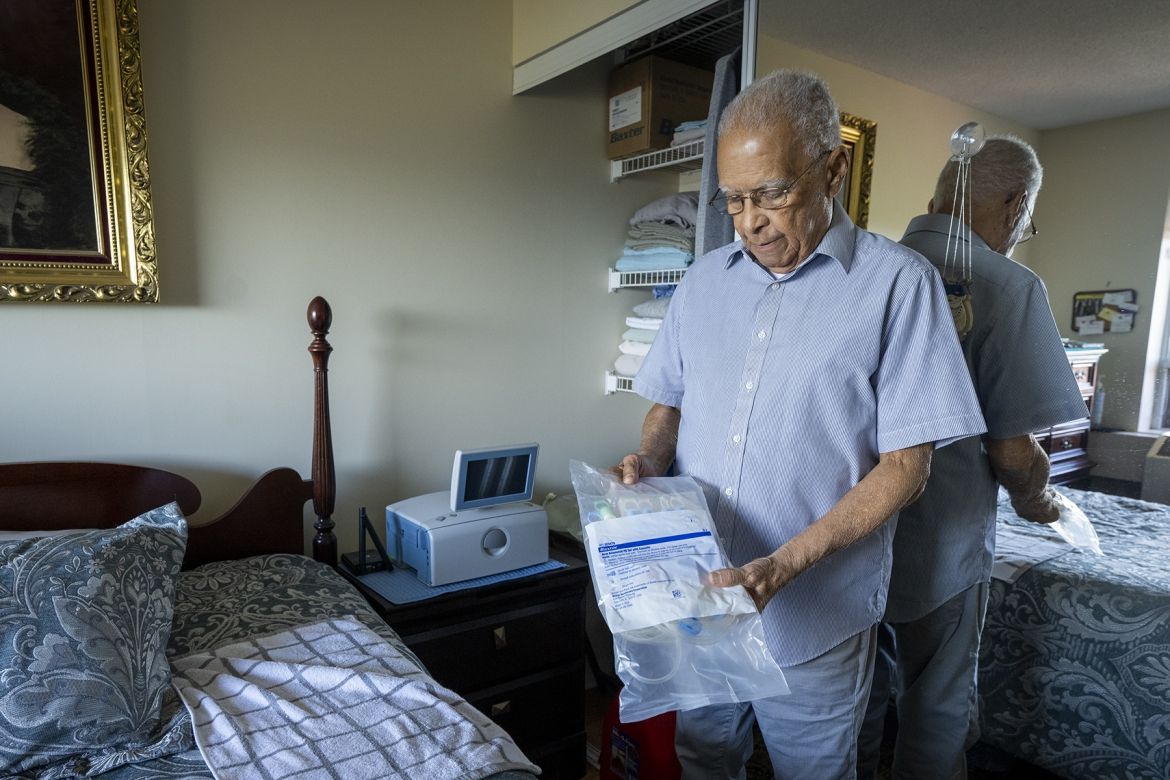Philippe showing his some of his home dialysis supplies