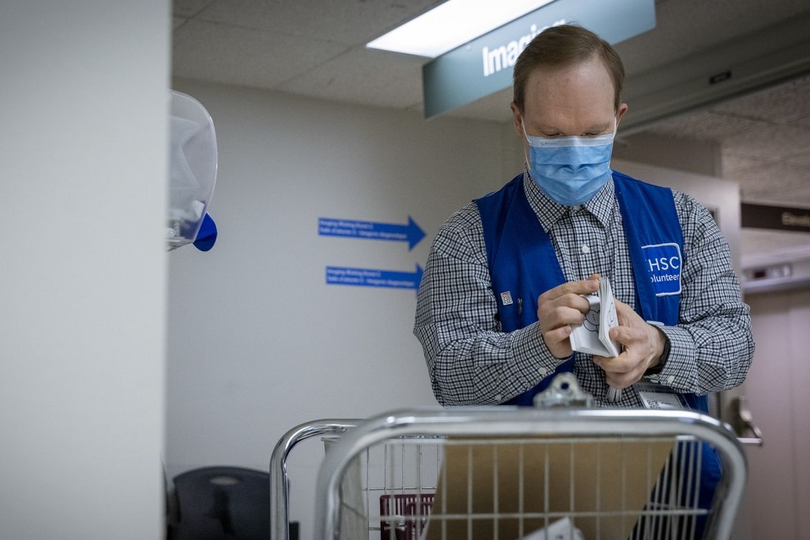 Jeff preparing pamphlets for delivery.