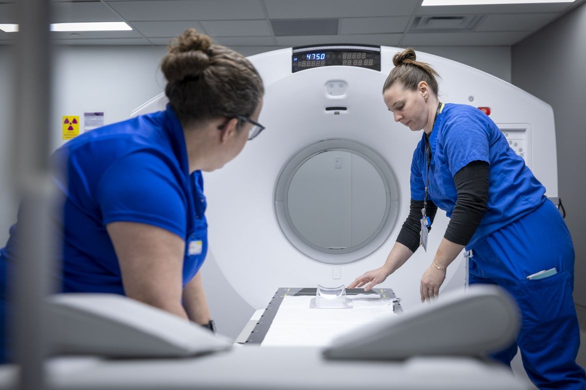 Staff work with KHSC's new PET-CT scanner