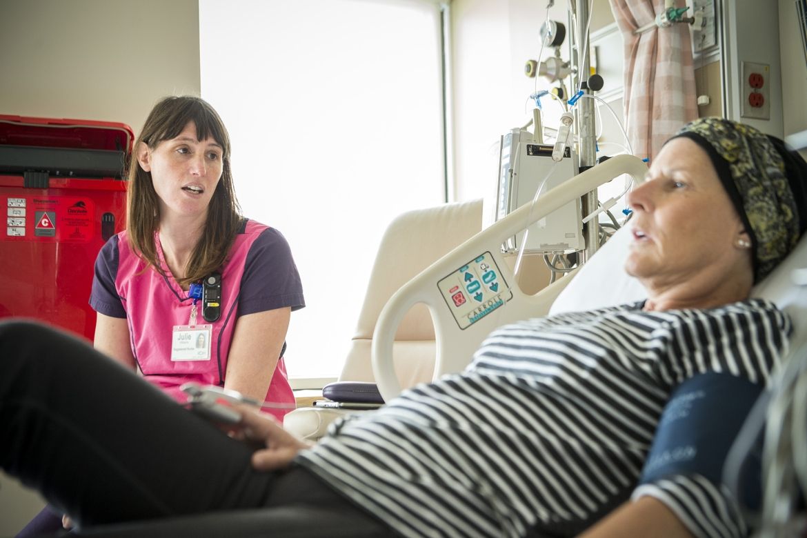 A KHSC nurse speaking with a patient