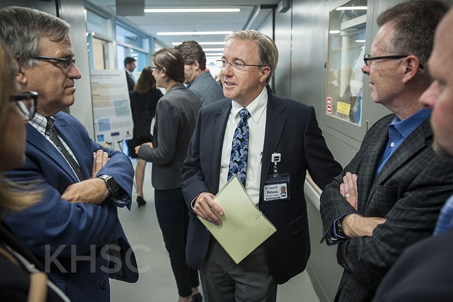 KHSC CEO Dr. David Pichora speaks with individuals touring the new centre
