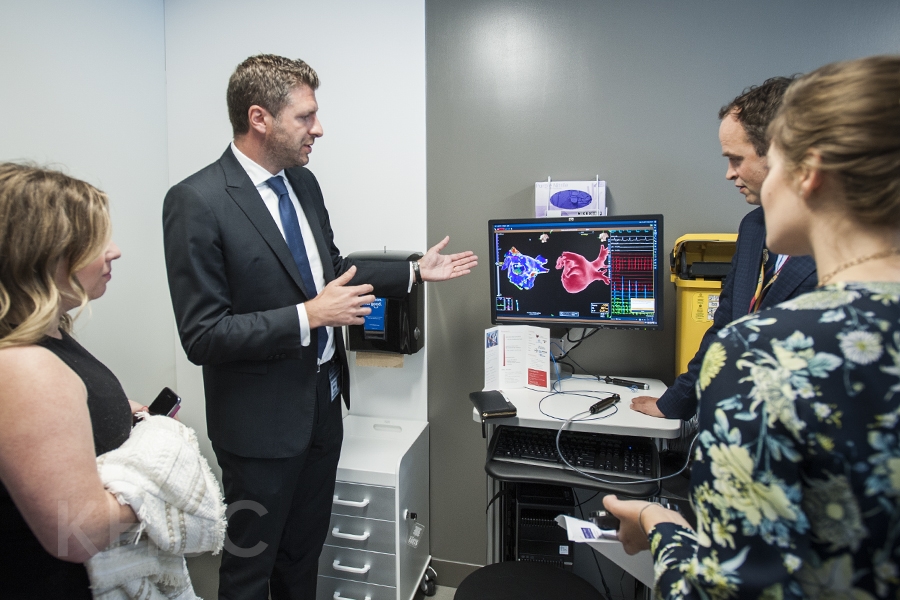 Dr. Gianluigi Bisleri and Dr. Ben Glover show their research to visitors during the grand opening