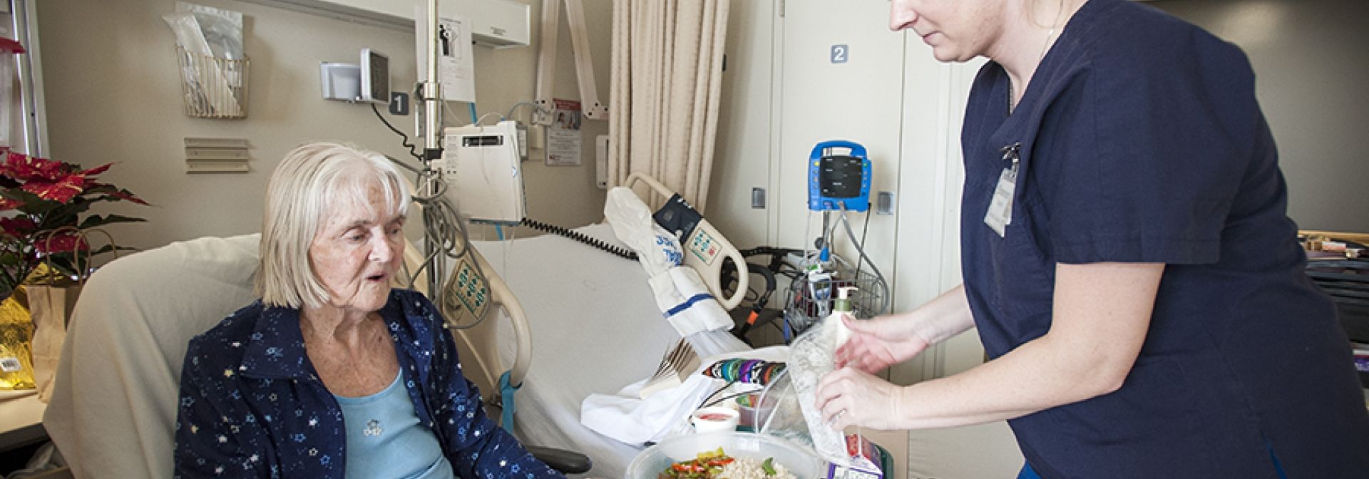 Patients receiving meals they have ordered.