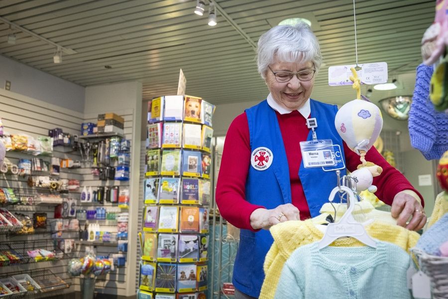 Volunteer working in the gift shop.
