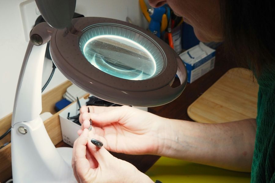 tech working on a hearing aid