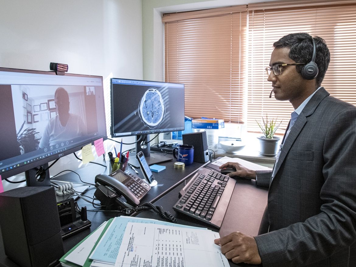 a doctor conducting a virtual visit with a patient