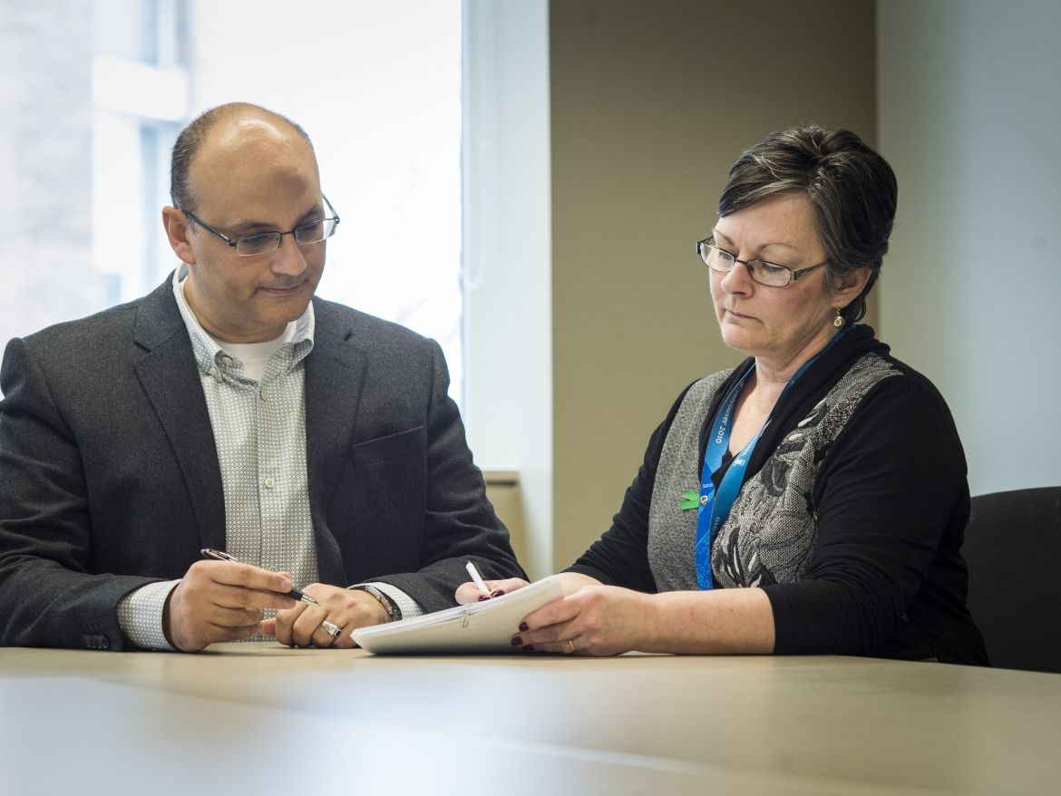Nephrologist Dr. Khaled Shamseddin was integral in helping to develop the new program. Here he meets with Donor Coordinator Arlene Funnel to review a patient chart.
