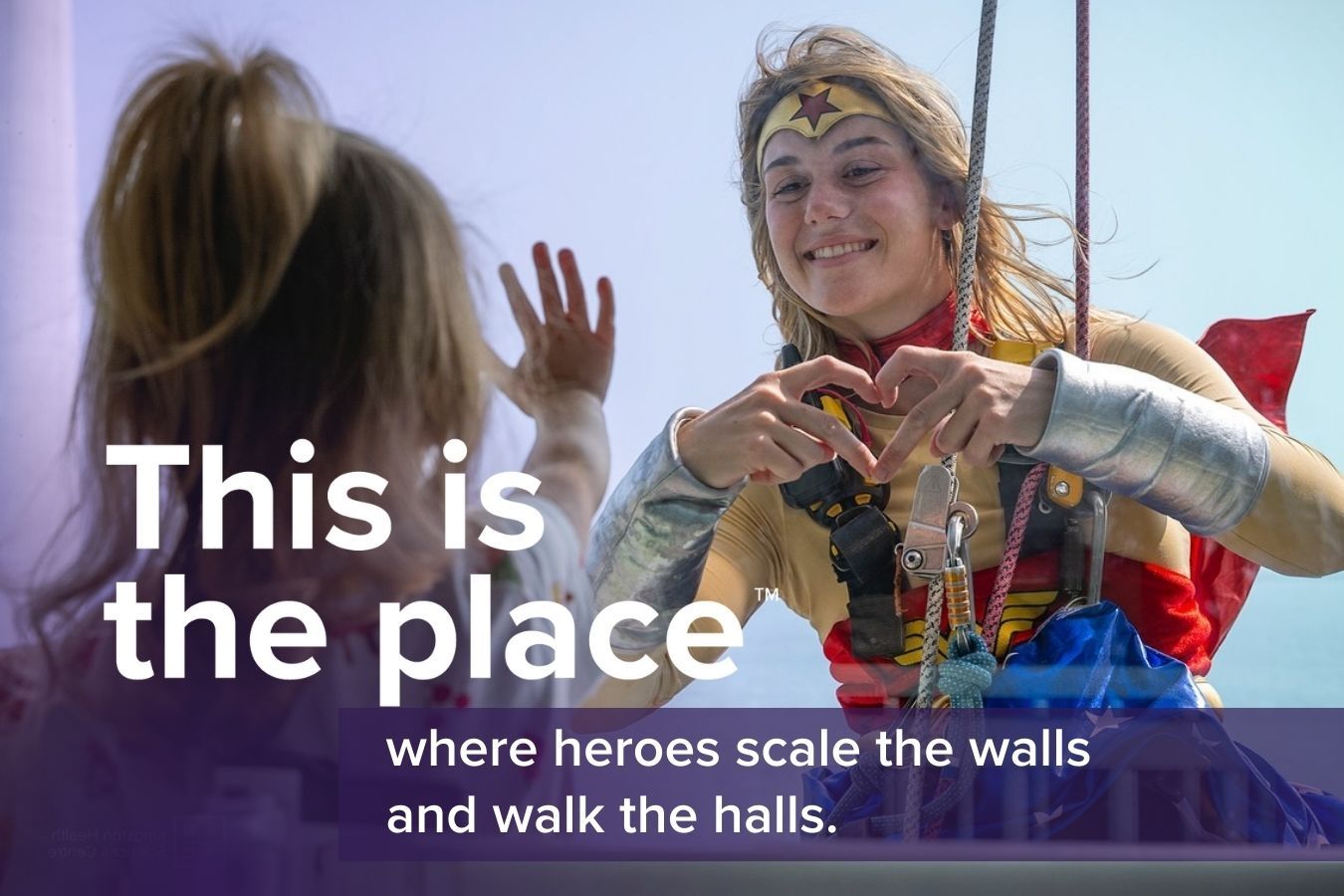 wonder woman looks through a window at a young girl